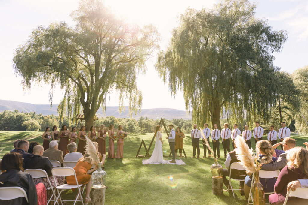 The outdoor wedding ceremony at Glen Brook Farm in the upper  Hudson Valley of New York.