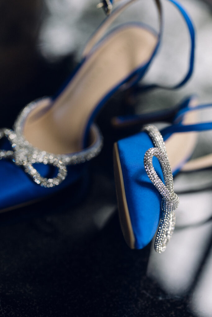 The bride's blue shoes with crystal bows.