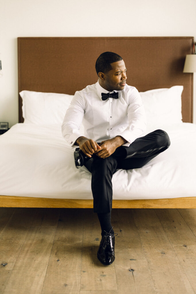 A groom gets ready for his wedding day in an New York City hotel room.