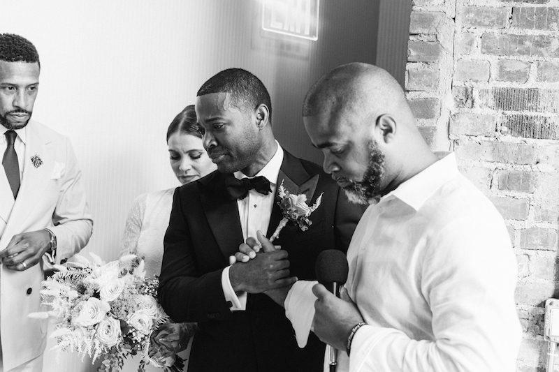 An emotional toast is given by the groomsmen, captured by New York City wedding photographer, Molli Photo.