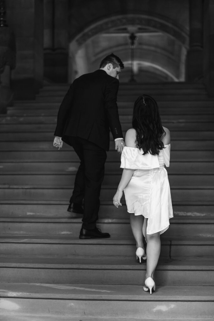 Walking up the steps to the New York State Capitol for engagement photos.