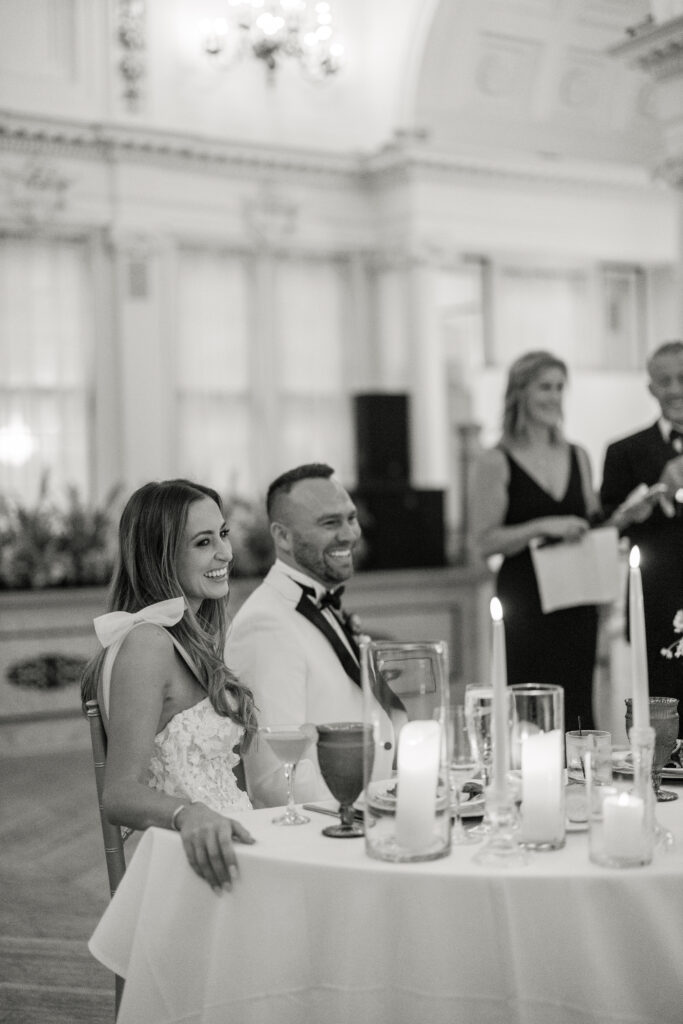 bride and groom laughing in upstate NY wedding venue